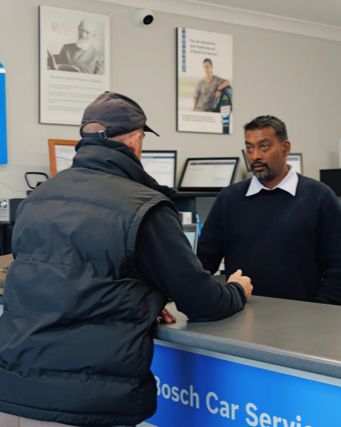 David Baker working with a client at their business