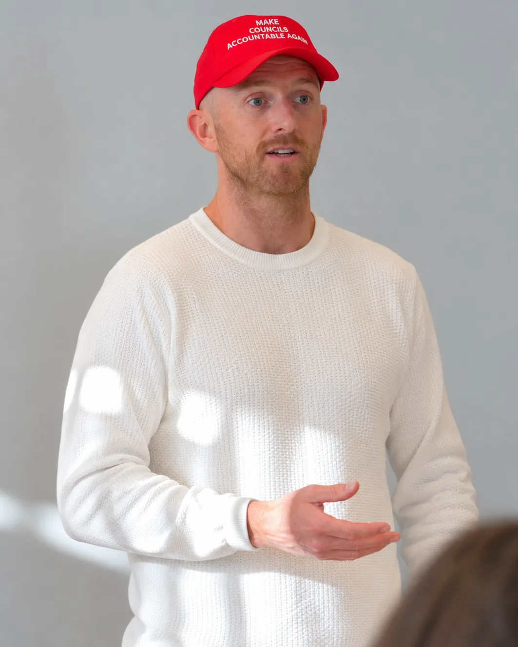 David Baker speaking with trade business owners at an industry event
